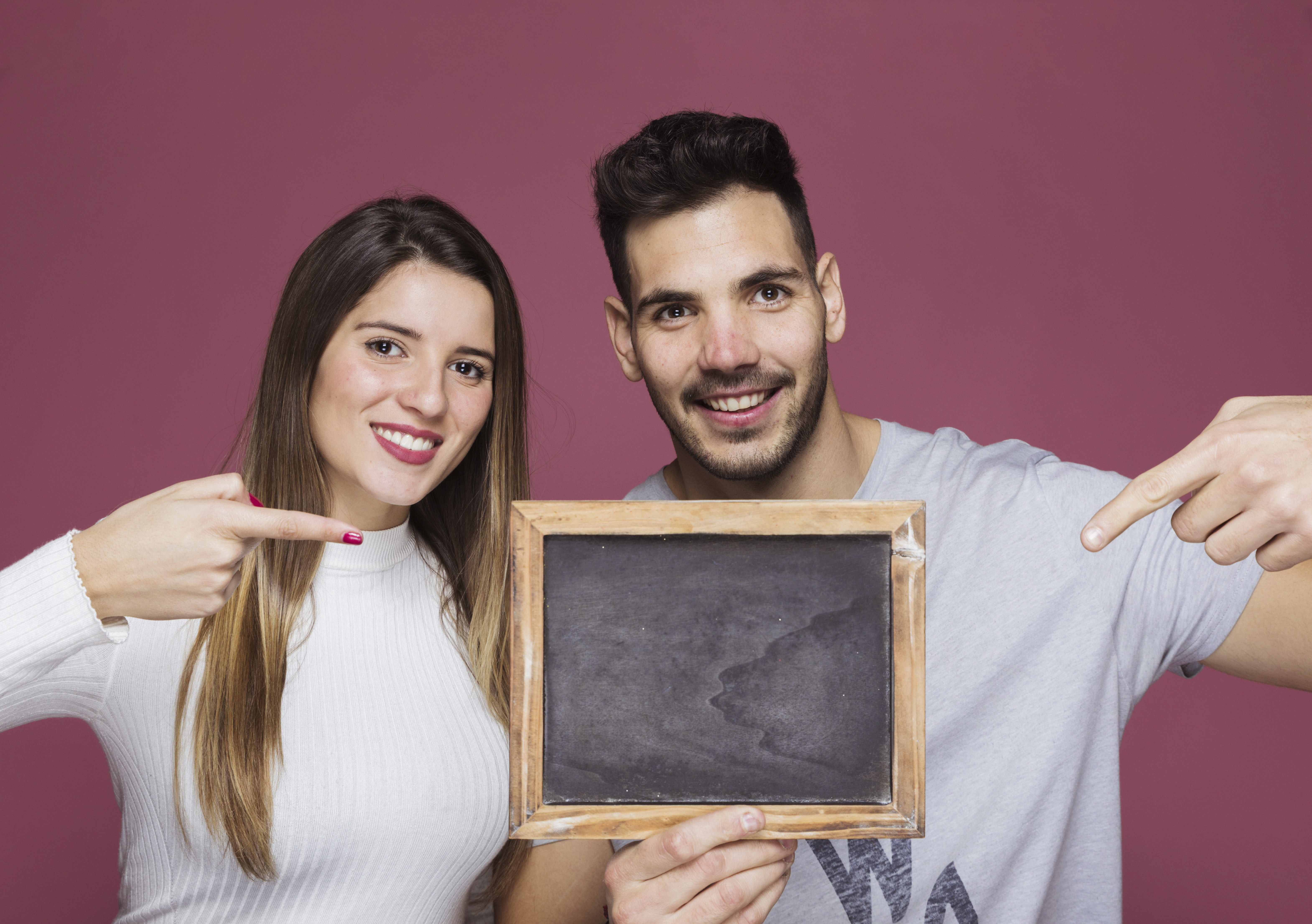 Happy couple displaying their marriage certificate